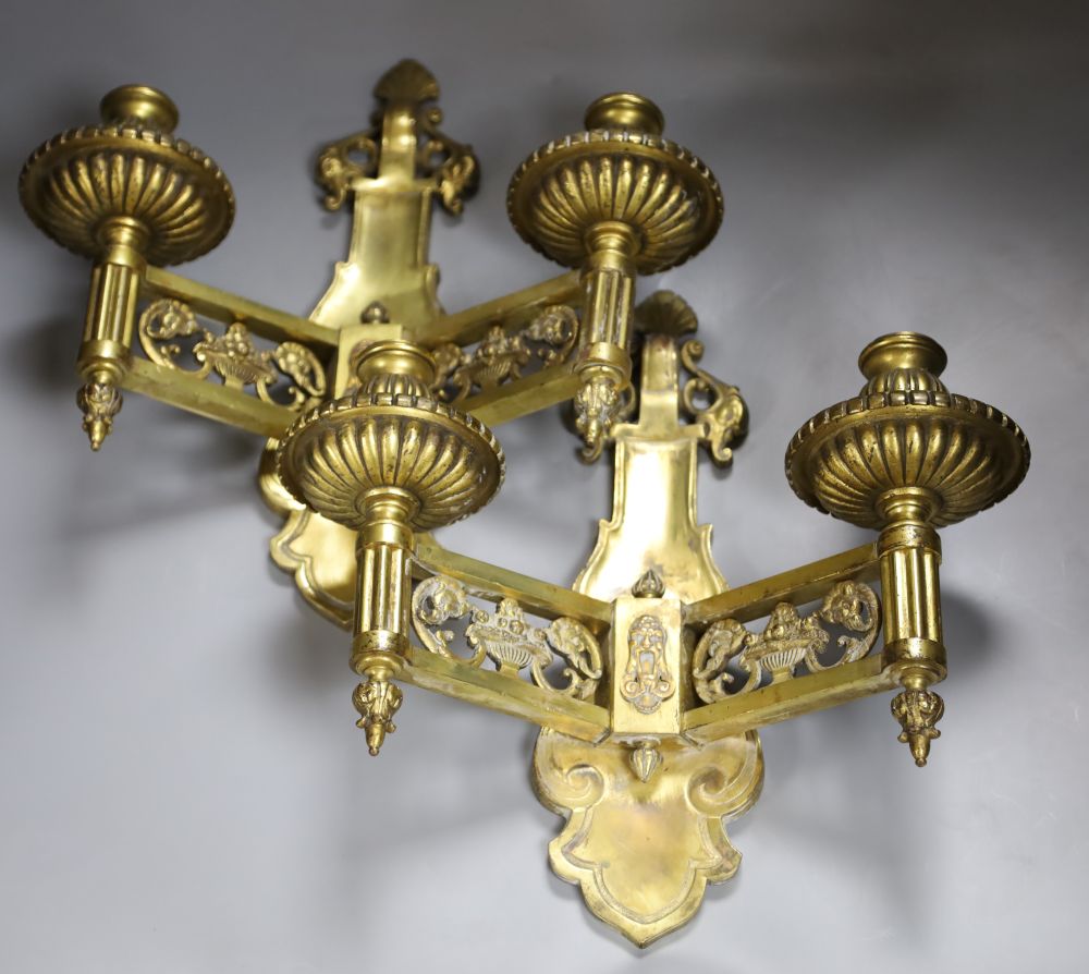 A pair of 19th century French cast brass wall sconces, length 36cm